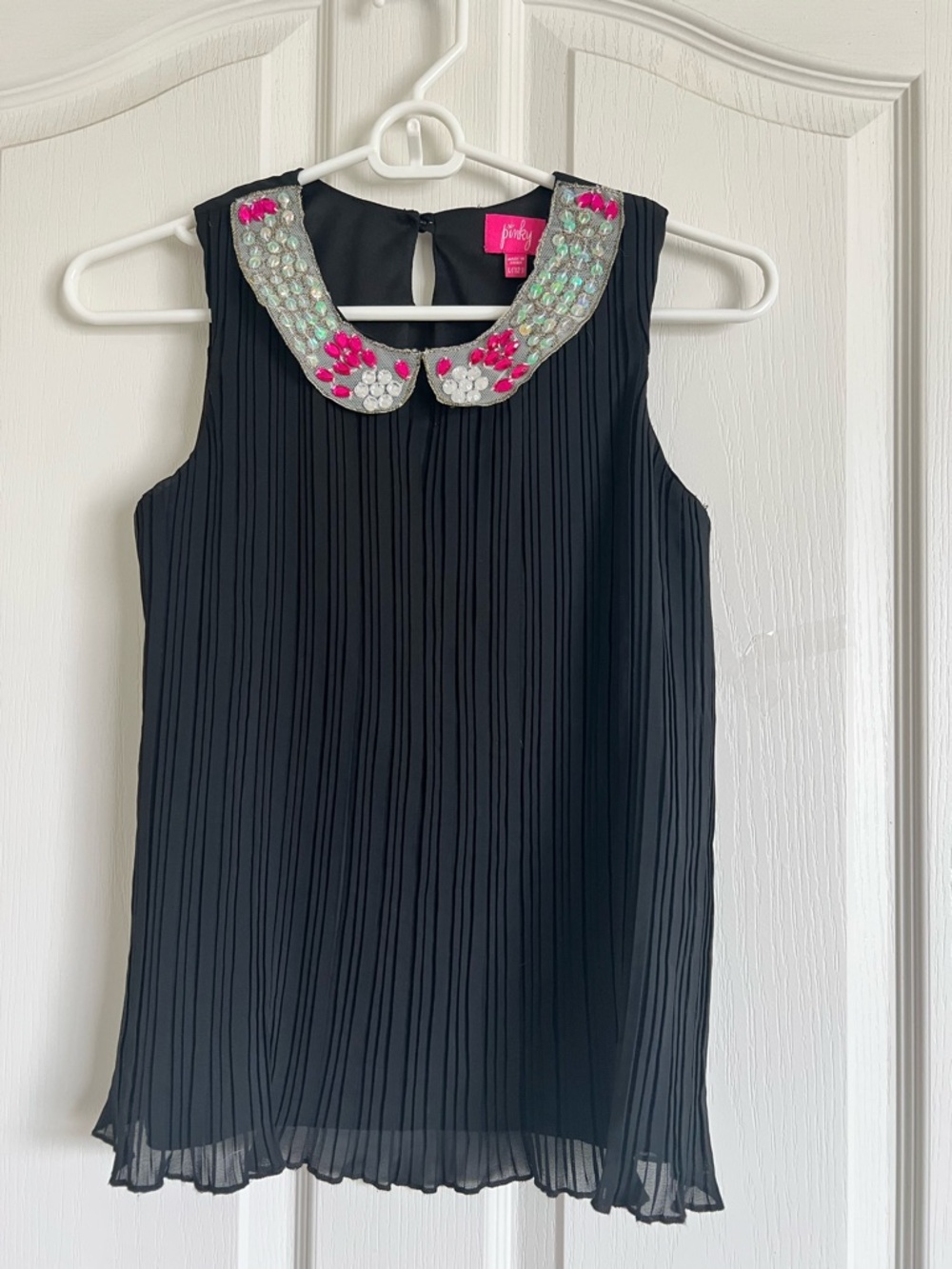 Pinky Hot Pink Logo Tag on Black Garment
